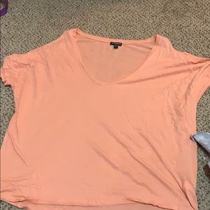 A pink off the shoulder short sleeve t shirt